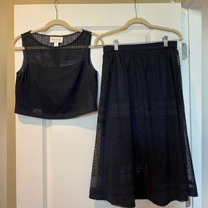 Women’s two piece navy top & skirt set.